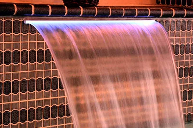 Close view of a waterfall sheet over patterned tile