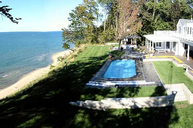 The pool, the lawn and the beach below, seen from above