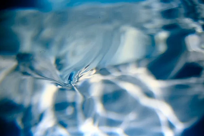 Sunlight rippling through clear water