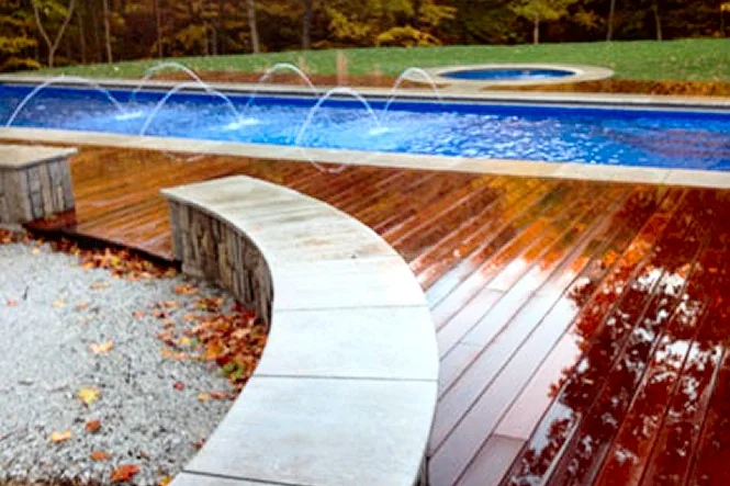 Curved coping meeting the wood deck boards