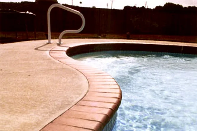 Inside curve of the Manatee pool with a steel handrail at the entry
