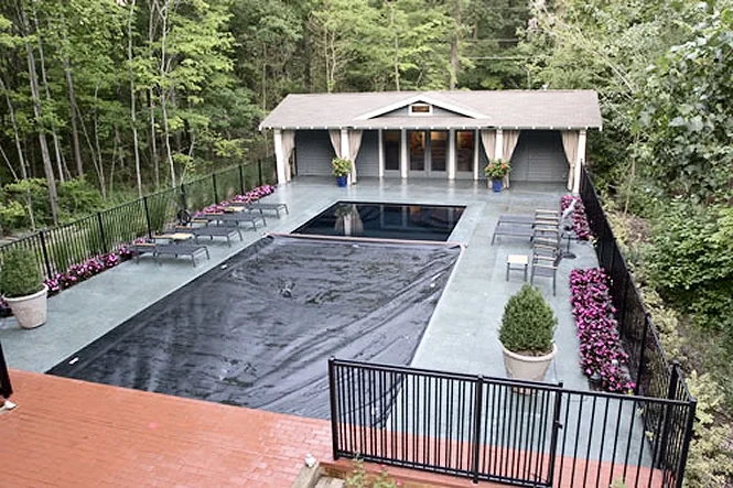 Aerial view with the automatic cover most of the way across the pool