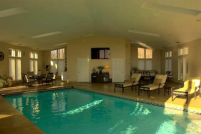 Wide view of the indoor pool and seating area
