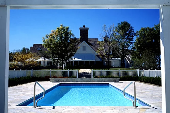 Daylight view of the pool and flagstone deck with the house behind