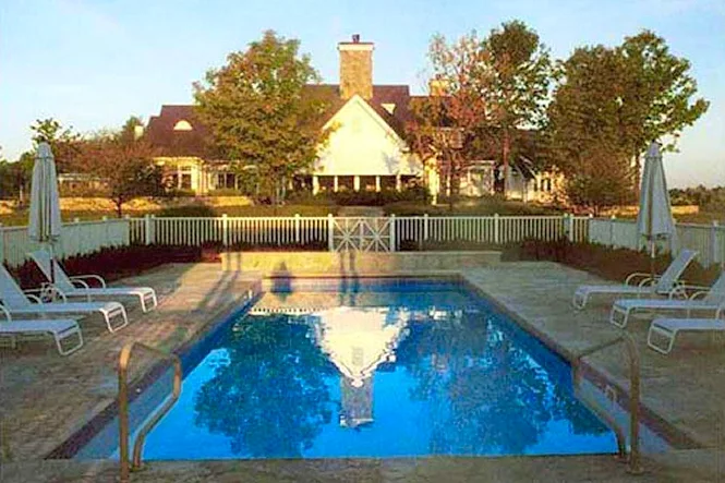 Morning sun on the pool, the flagstone deck and the house