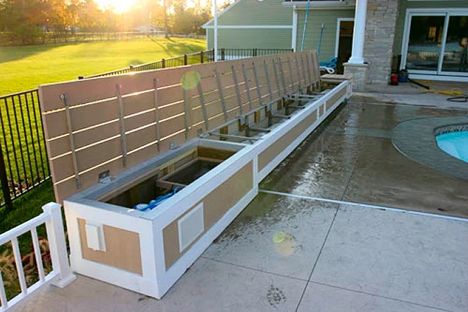 Raised planters along the deck beside the spa
