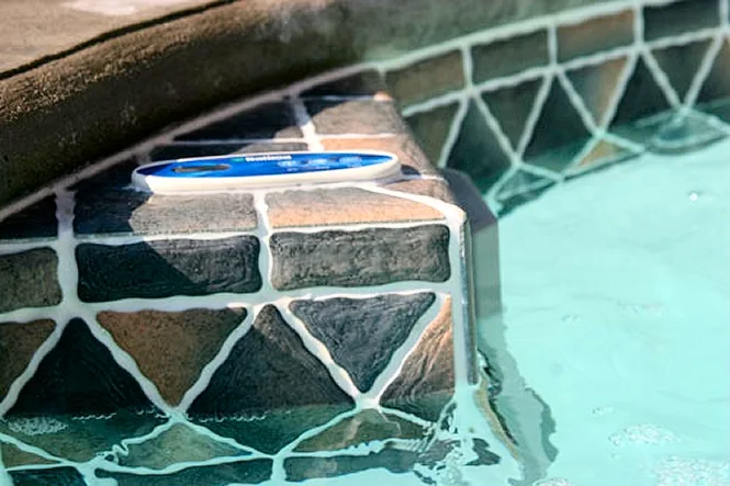 Close view of patterned tile at the edge of the spa